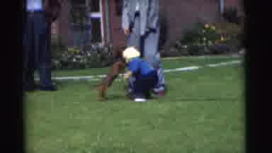 Chatham New Jersey (1951): A Person Hugging A Child As A Dog Excitedly Runs Around