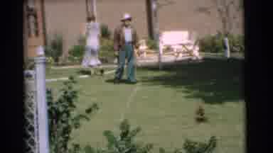 Chatham New Jersey (1951): Papa Entertaining Playful Puppy While Mommy Is Running
