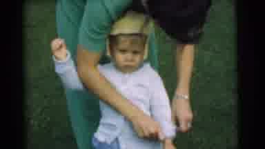 Chatham New Jersey (1951): A Woman Straightening Out A Little Kids Clothing