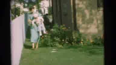 Chatham New Jersey (1951): Mother Sets Down Child In Yellow Hat Onto Green Mowed
