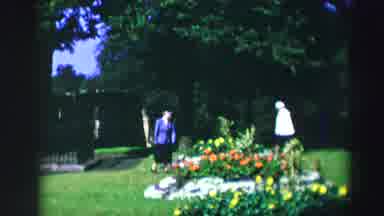 EDINBOURGH SCOTLAND-1952: Two Women Stroll Through a Spring Garden