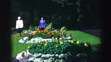 Edinbourgh Scotland (1952): Women Inspect Flowers In A Garden