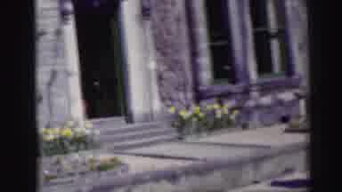Edinbourgh Scotland (1952): Man In A Village Walking Down A Sidewalk And Crossing