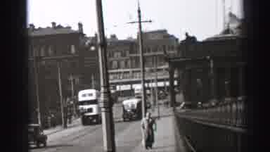 EDINBOURGH SCOTLAND-1952: A Busy City Road With Moving Traffic And People