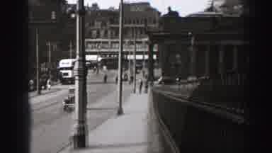 EDINBOURGH SCOTLAND-1952: People Walking On Sidewalk On A Clear Sunny Day