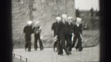 EDINBOURGH SCOTLAND-1952: Vintage Sailors Walking Near Historic Stone Building