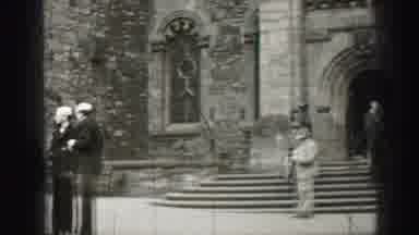 EDINBOURGH SCOTLAND-1952: People In Formal Wear Outside Stone Cathedral