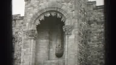 Edinbourgh Scotland (1952): A Large Romanesque Building With Partly Cloudy Skies