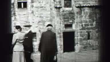 EDINBOURGH SCOTLAND-1952: Two Nicely Dressed Women And One Man Stand Outside An