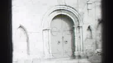 EDINBOURGH SCOTLAND-1952: Black And White Footage Of A Historic Church Facade With Double Doors