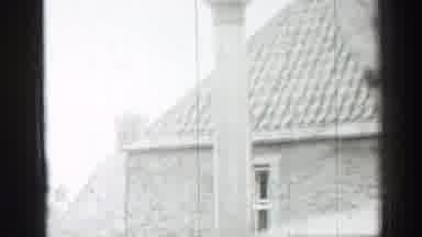 EDINBOURGH SCOTLAND-1952: Woman Watching Man Fix A House