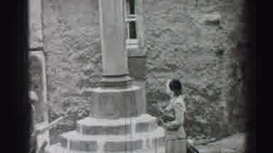 EDINBOURGH SCOTLAND-1952: A Man And A Woman Strolling The Castle Grounds
