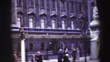 EDINBOURGH SCOTLAND-1952: Ornate Building Entrance With Pedestrians And Lion Statues