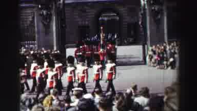 EDINBOURGH SCOTLAND-1952: British Soldiers Marching In Red Uniforms At Palace
