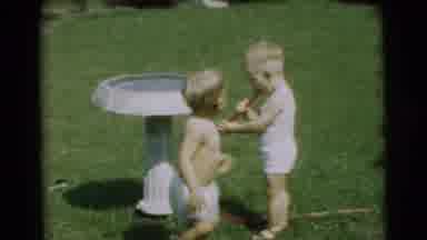 Pennington New Jersey-1954: Two Boys Playing With Hose In Backyard
