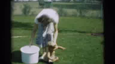 Pennington New Jersey (1954): Mother And Child Playing With Large Bucket On Grass