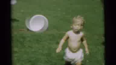 Pennington New Jersey (1954): Two Toddlers Play With A Garden Hose On A Lawn While