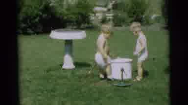 Pennington New Jersey (1954): Two Babies Are Having Fun With A Hose While Outside