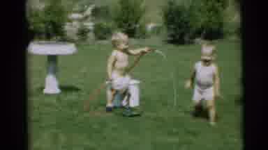 Pennington New Jersey (1954): Two Children Playing With A Water Hose In The Yard