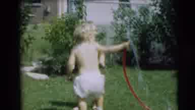 Pennington New Jersey (1954): Children Play With A Hose Outside The House On A