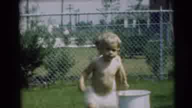 Pennington New Jersey (1954): Two Children Playing Outside With A Hose And A