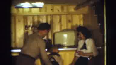 Pennington New Jersey (1954): Mother And Father Lift Child Onto Chair And He Peers