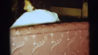 Pennington New Jersey (1954): Lady Sitting On Sofa Turns Around Toward Camera