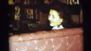 Pennington New Jersey (1954): Woman Wearing Blue Shirt Sits On Red Sofa At Holiday