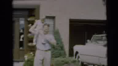 Pennington New Jersey (1954): Father Holding Up His Child In The Front Yard By The
