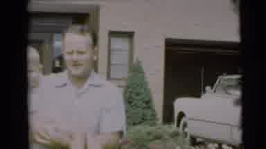 Pennington New Jersey (1954): A Man Carrying A Little Boy From A House Toward