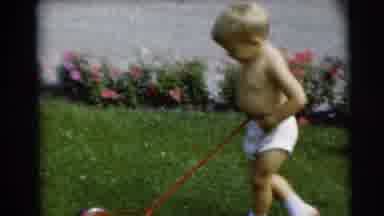 Pennington New Jersey (1954): Shirtless Child Trying To Mow Lawn On A Sunny Day