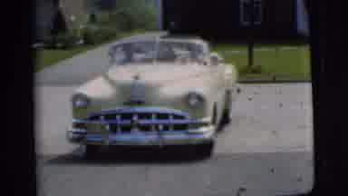Pennington New Jersey (1955): Retro Yellow Car Reverses Out Of A Driveway