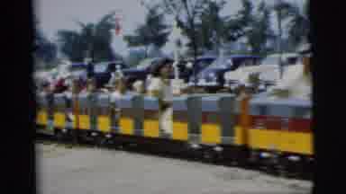 All aboard for the teeny train ride, where adults act like kids!