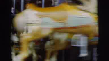 Pennington New Jersey (1955): A Moving Carousel With Lots Of People Riding It On A