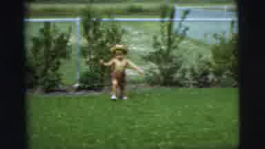 Pennington New Jersey (1955): A Little Boy Wearing A Hat And Shorts Running