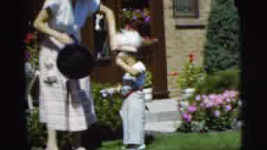 Pennington New Jersey (1955): A Mother Helping Son With A Toy
