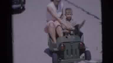 Pennington New Jersey (1955): A Boy And His Mother Riding In A Toy Car