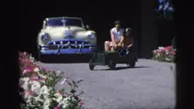 Pennington New Jersey (1955): Mom And Son Having Fun Driving Mini Toy Car Around