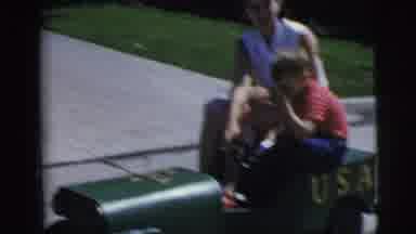 Pennington New Jersey (1955): Mom And Child Riding Car Down The Street Together