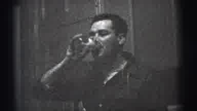 New York City (1956): Man Drinks Beer Next To His Wife In The Kitchen Of His