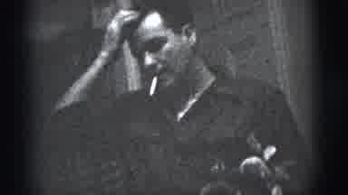 New York City (1956): One Man Standing In The Front Of The House And Smoking A