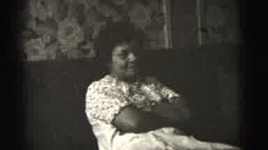 New York City (1956): Black And White Video Of Lady Sitting On Sofa With Arms