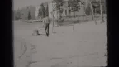 New York City (1956): A Man Is Walking His Dog Right Near The Water