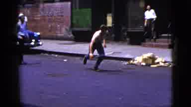 New York City (1956): A Man Drops A Weapon Then Runs Down The Street