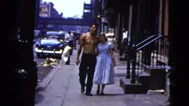 New York City (1956): A Man And Woman Walking Together On A Sidewalk In The City