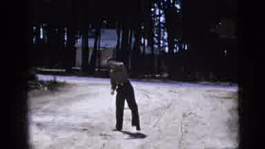 New York City (1956): Two Men Outside Playing Catch With Each Other On A Sunny Day