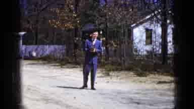 New York City (1956): Man In Blue Suit Standing In Road With Baseball Glove