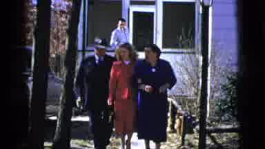 New York City (1956): Dressed Up People Walking Out Of A House And Conversing