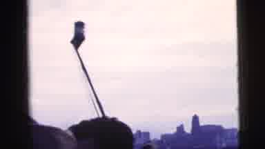 New York City (1958): A Ferry Slowly Moves Through The Water While Silhouettes Of