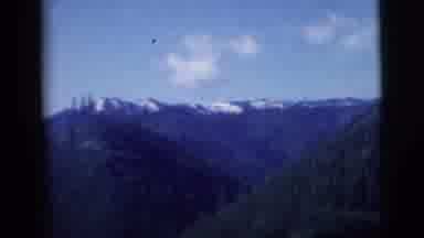 New York City (1958): Some Mountains And Then Some Farmland Is Seen Through The